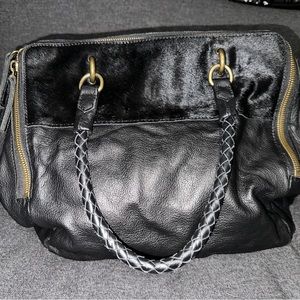 Barely used. Liebeskind Berlin black leather bag with cow hair on the front.